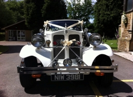 White vintage wedding car in Petersfield